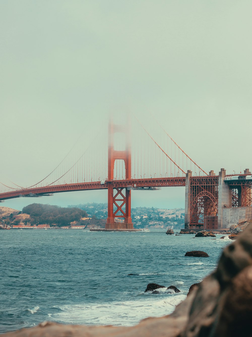 a view of the golden gate bridge from the shore