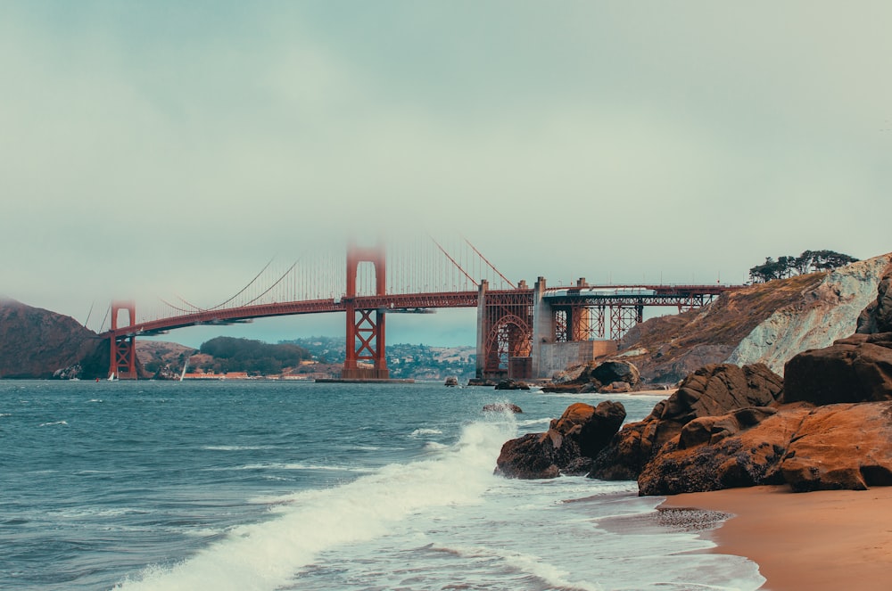 a view of the golden gate bridge from the beach