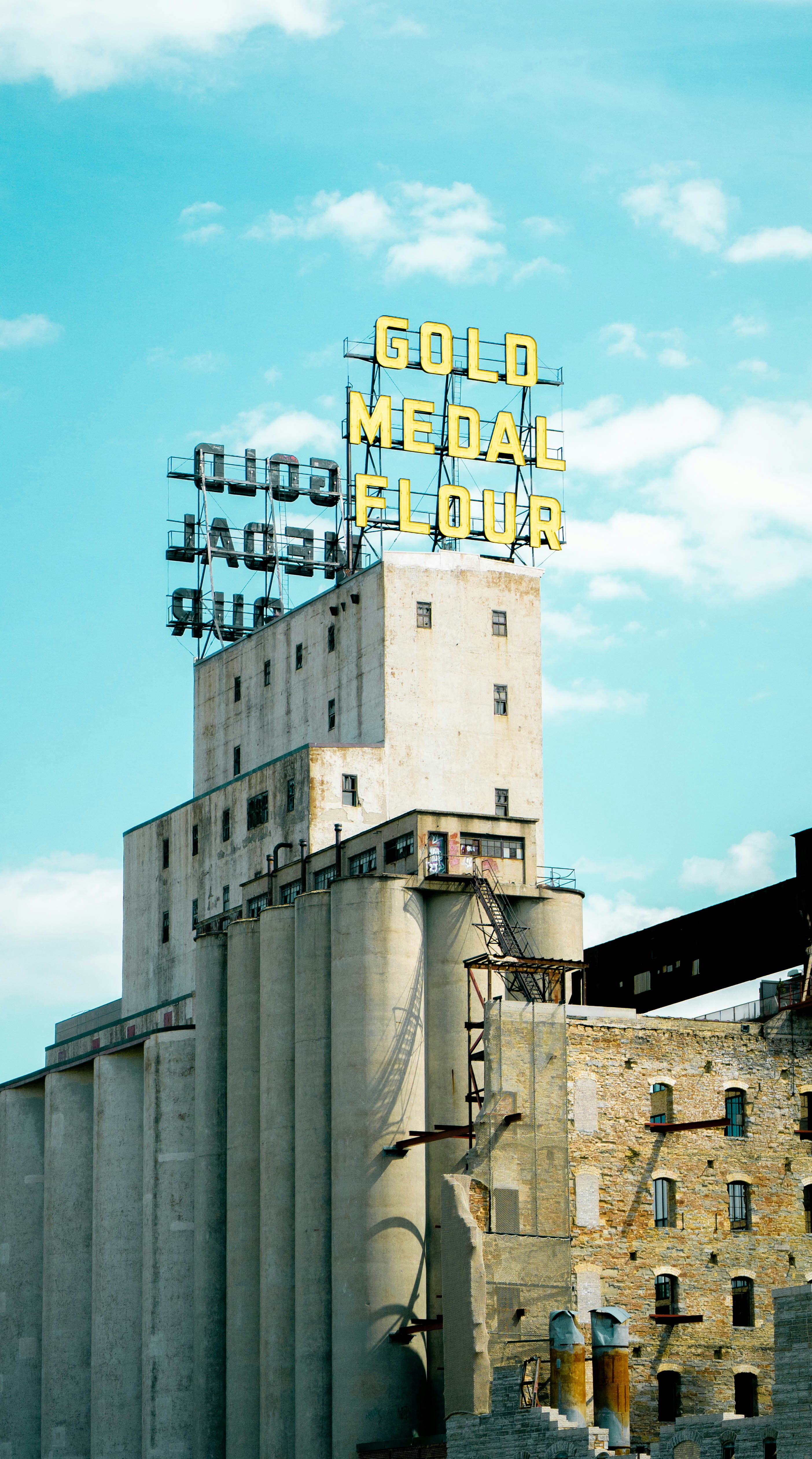 a tall building with a sign on top of it