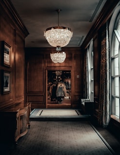 A hallway adorned with elegant decorative panels and subtle ambient lighting.