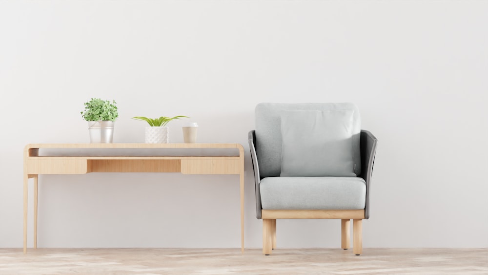 a chair next to a table with a potted plant on it