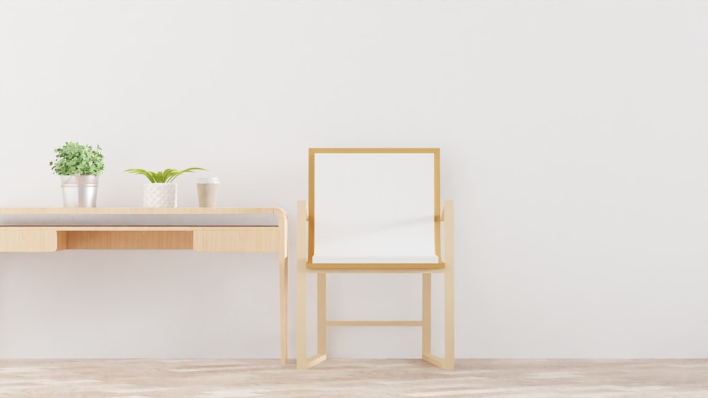 a desk with a chair and a potted plant