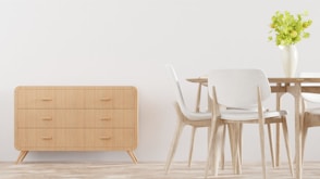 a table with a vase of flowers on top of it