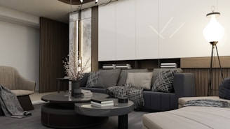a living room filled with furniture and a lamp