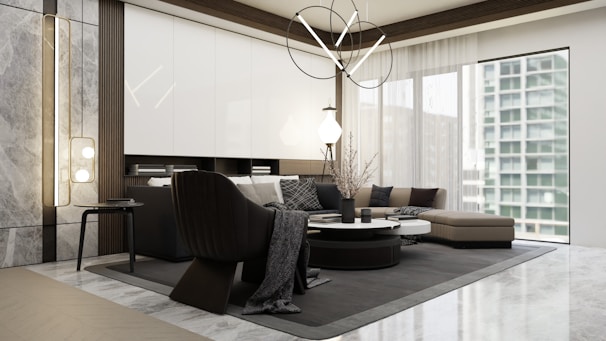 Modern living room with sleek furniture and dark accents.