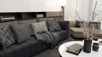 a living room filled with furniture and a white table
