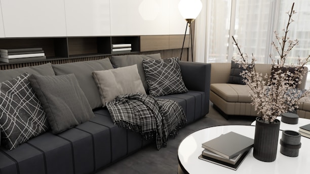 a living room filled with furniture and a white table