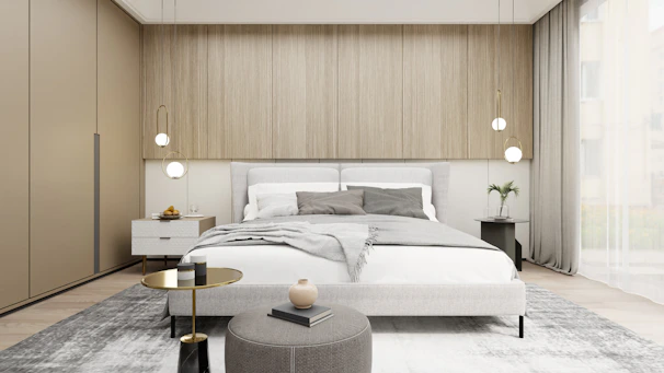 A serene bedroom with muted tones, textured fabrics, and a statement pendant light.
