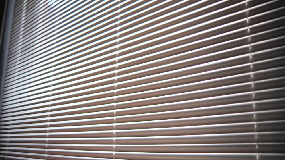 a close up view of a window with blinds