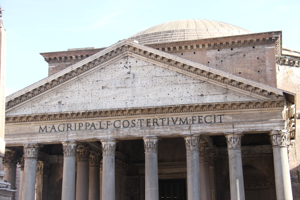 a large building with columns and a dome