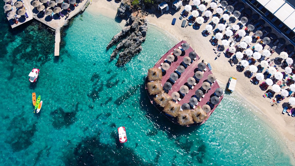 a group of boats floating on top of a body of water