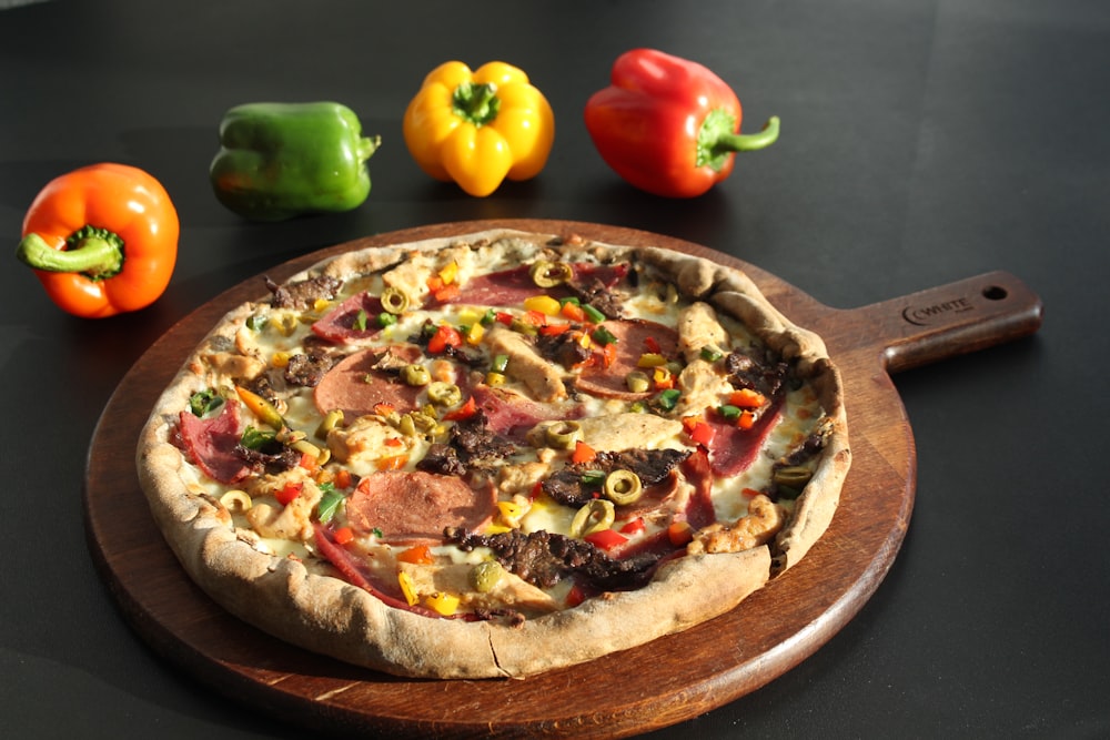 a pizza sitting on top of a wooden cutting board