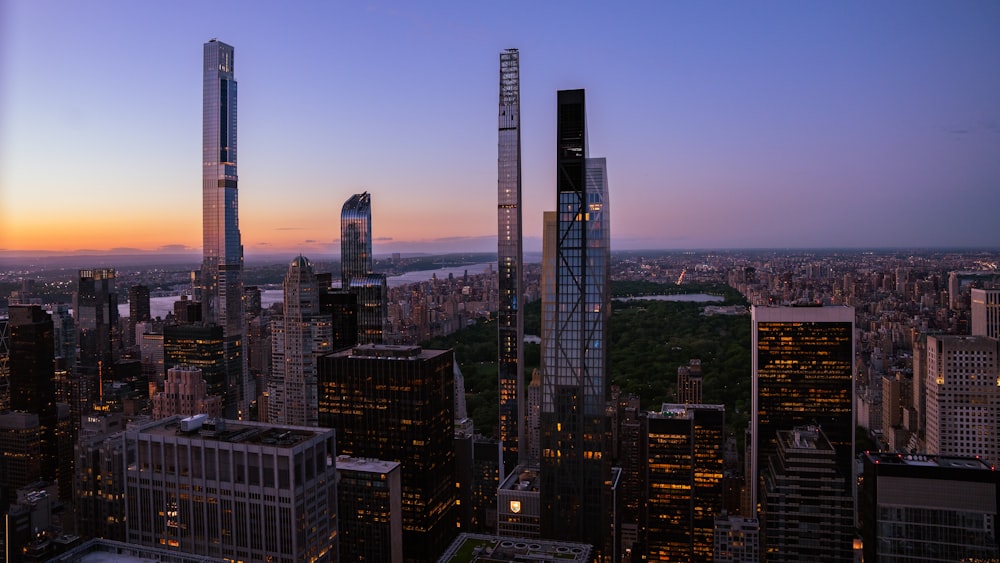 an aerial view of a city at dusk