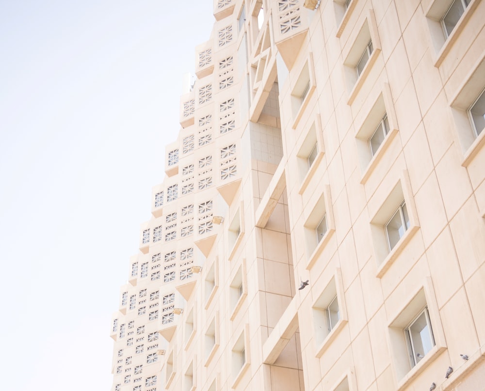 a tall building with many windows on the side of it