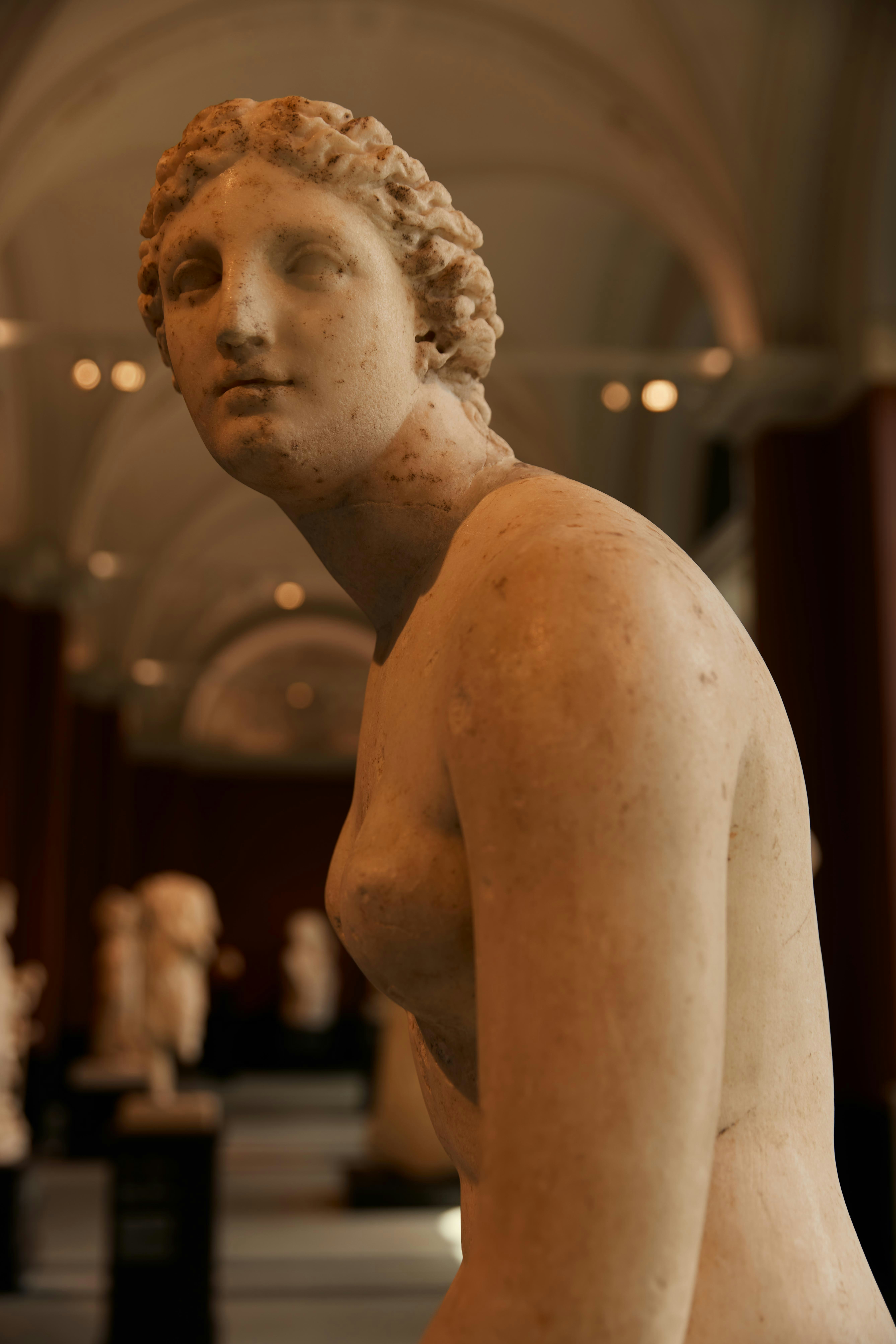a statue of a woman in a museum