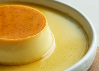 a small dessert on a white plate on a wooden table