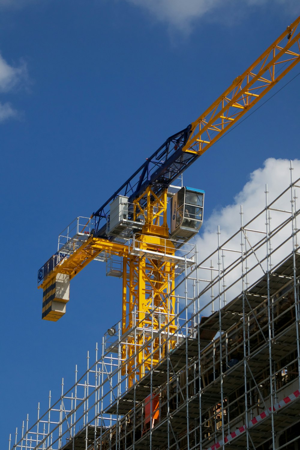 a crane is on top of a building under construction