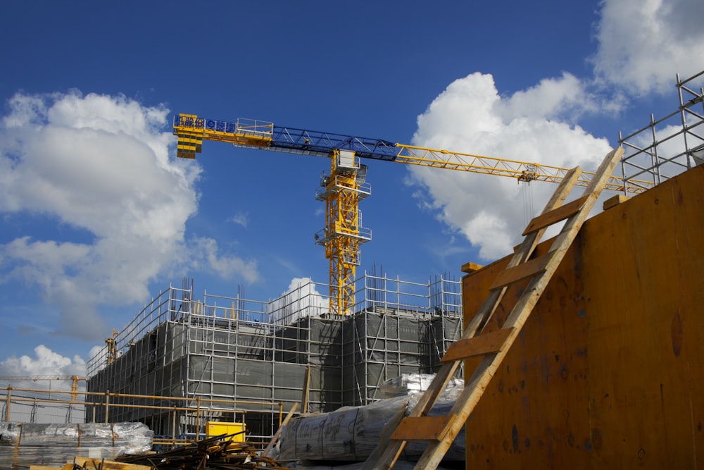 a construction site with a crane and a building under construction