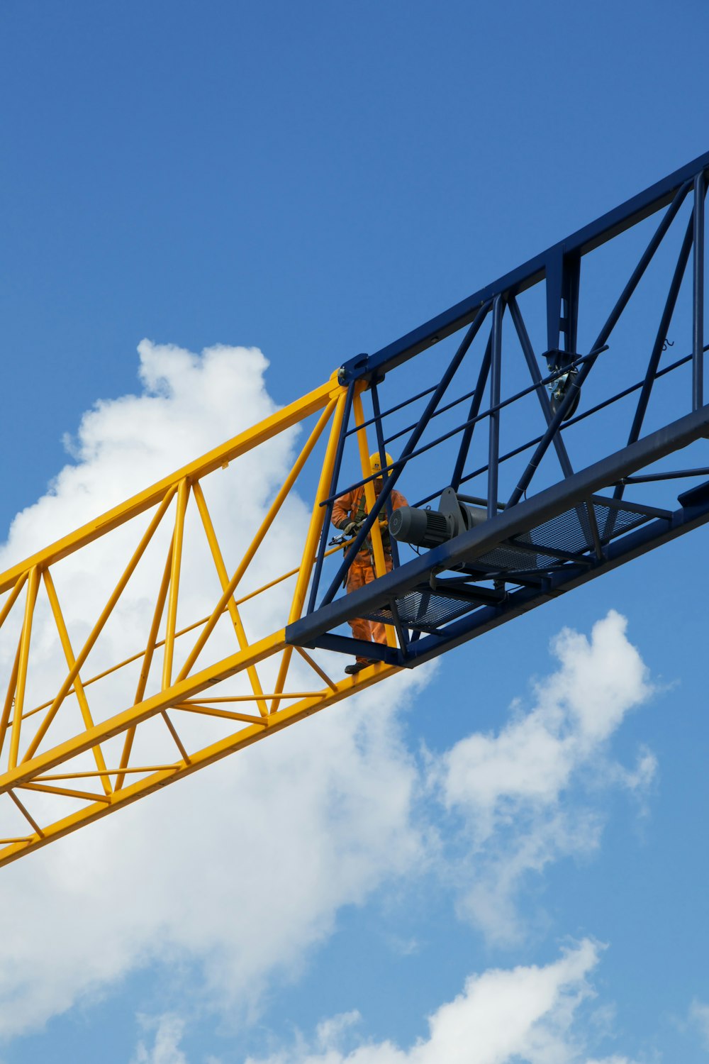 a man is working on a crane in the sky