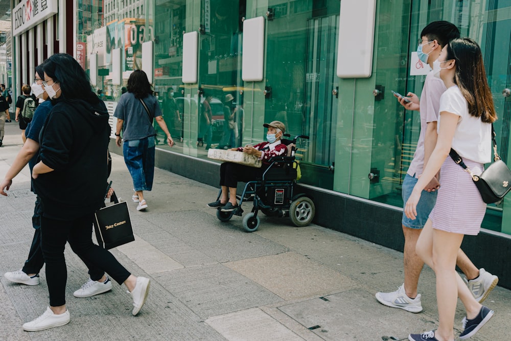 a group of people walking down a street