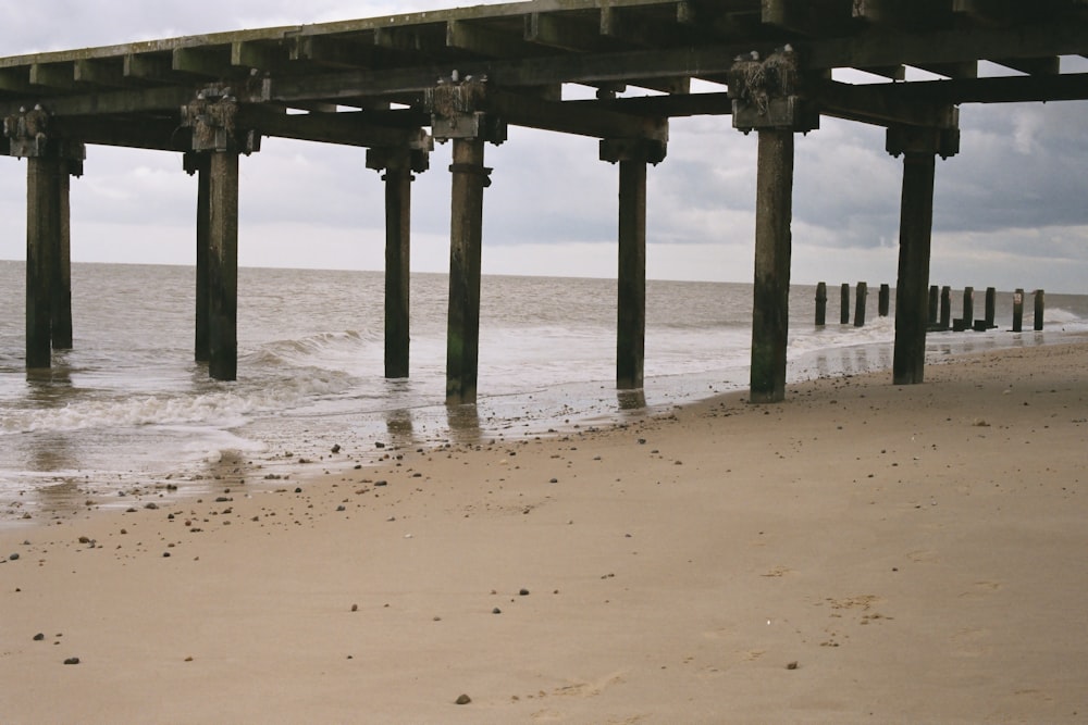 a long pier stretches out into the ocean