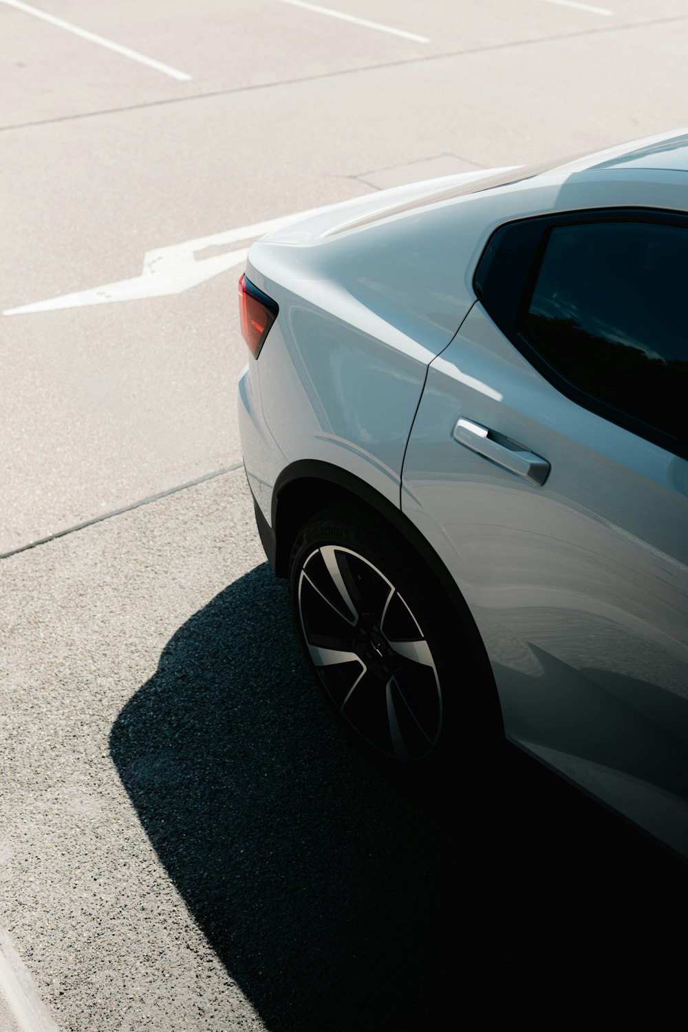 a white car parked on the side of the road