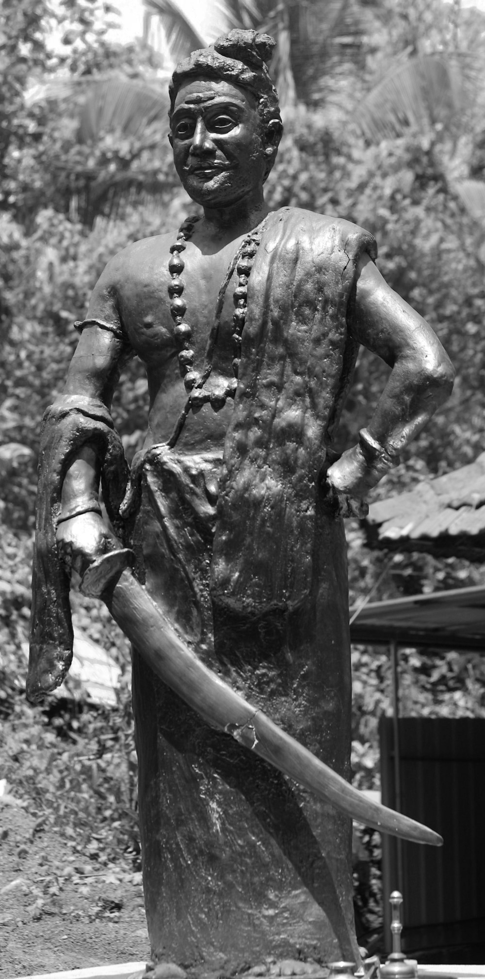 a statue of a man holding a sword