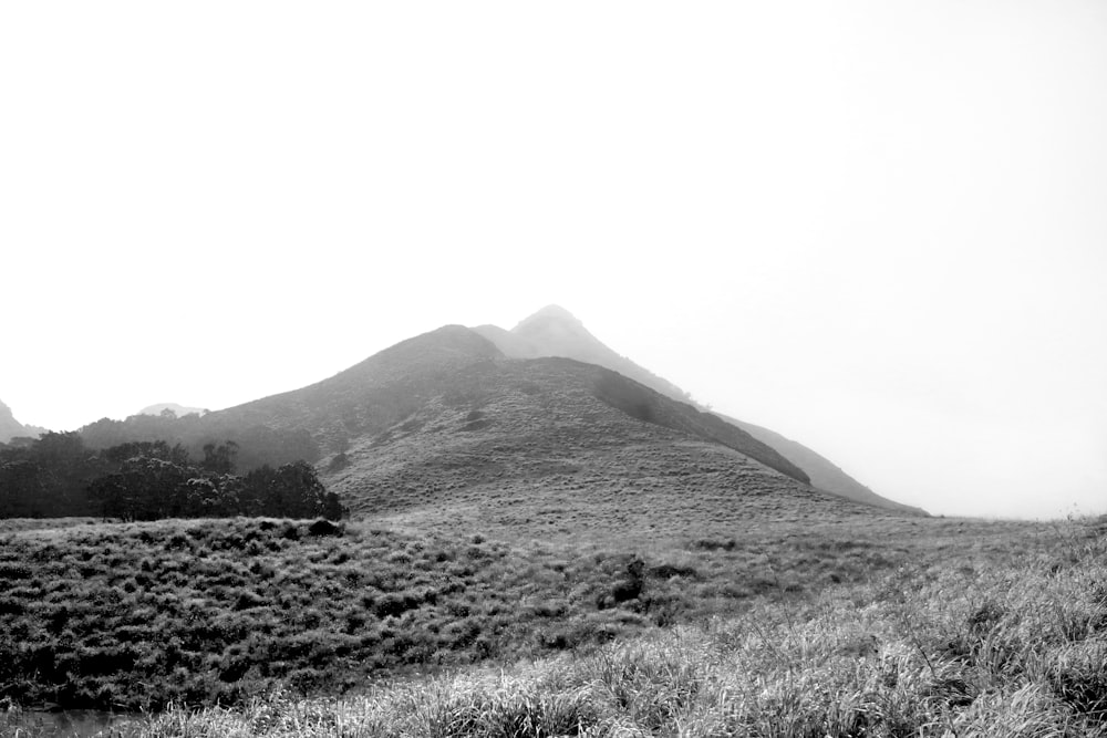 a black and white photo of a mountain range