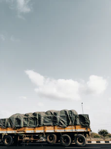 A sturdy Trusthaul truck loaded with cargo, ready to hit the road on a clear day.