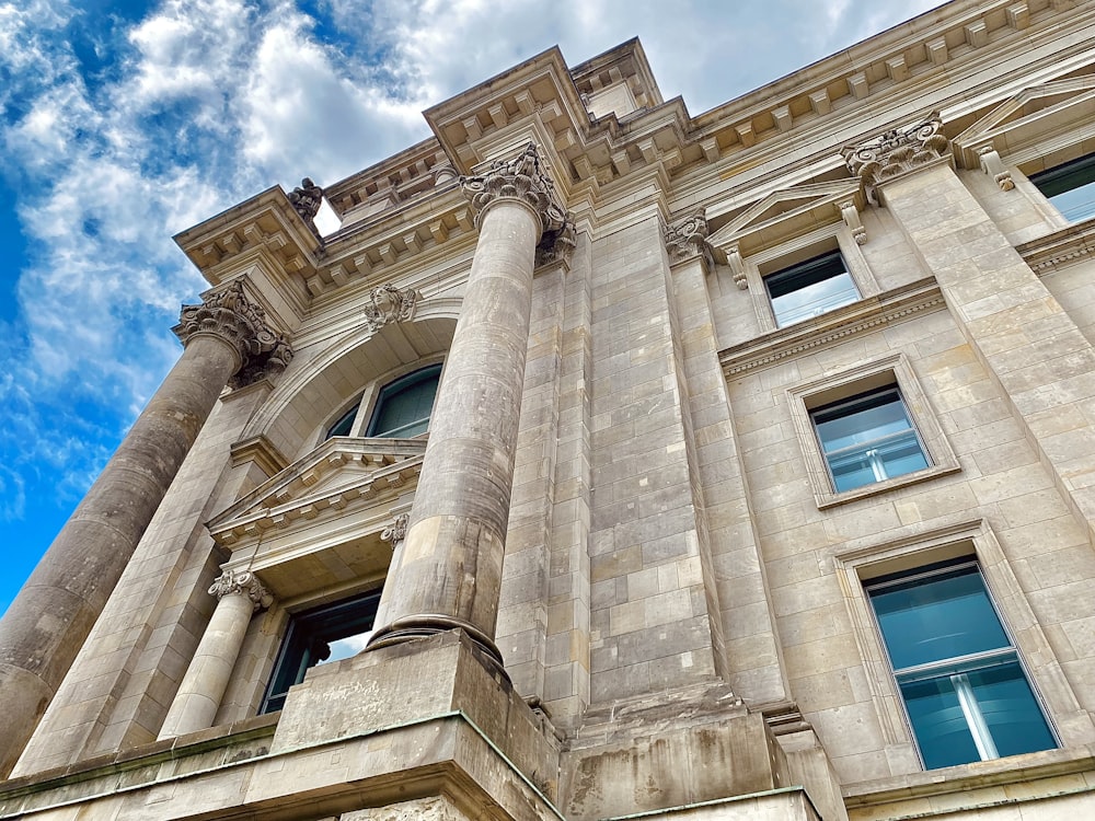 a very tall building with many windows and pillars