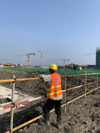 a construction worker standing on a construction site