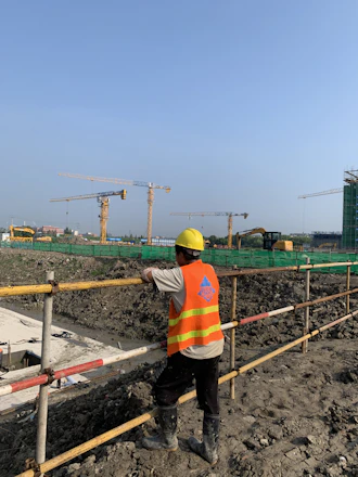 a construction worker standing on a construction site