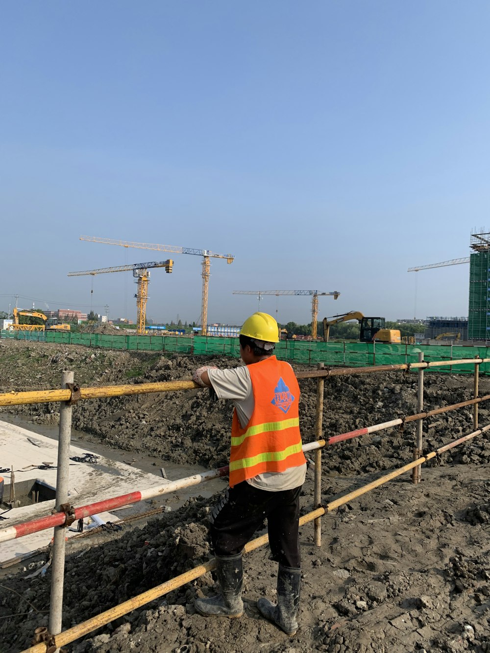 a construction worker standing on a construction site