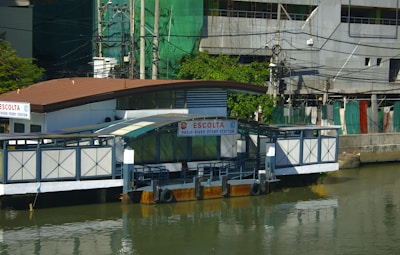 a house boat floating on top of a body of water