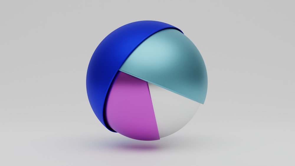 a blue, pink, and white ball with a diagonal design