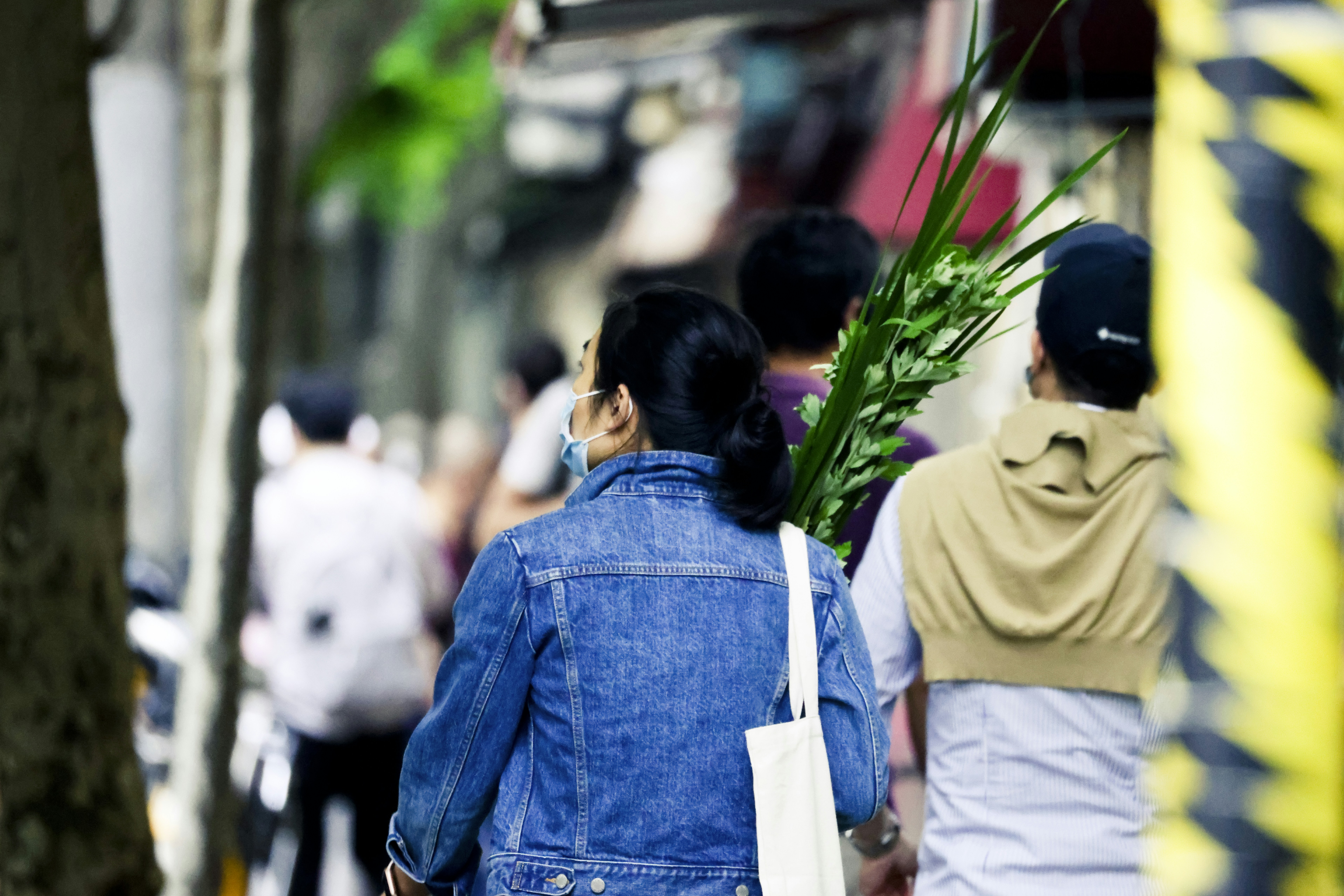 a group of people walking down a street