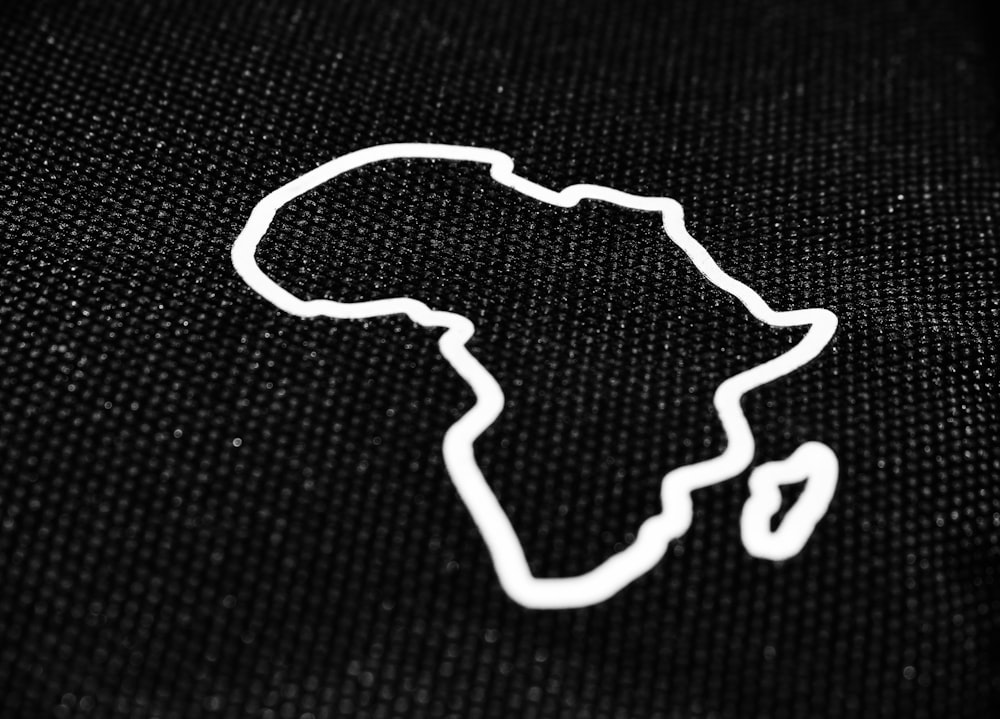 a black bag with a white outline of africa