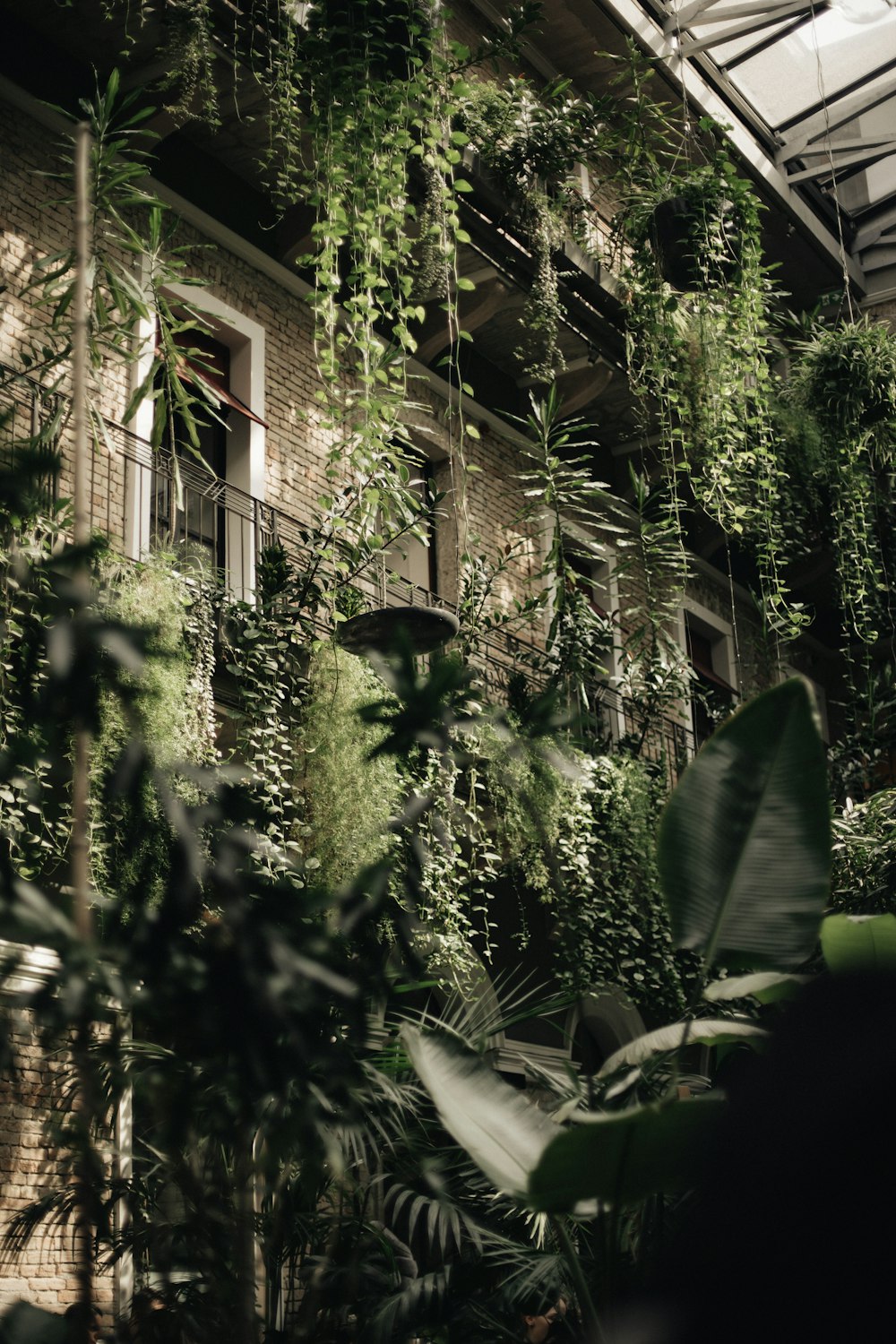 a building covered in lots of green plants