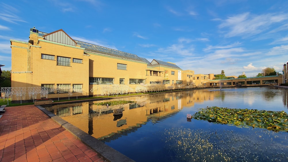 a building next to a body of water