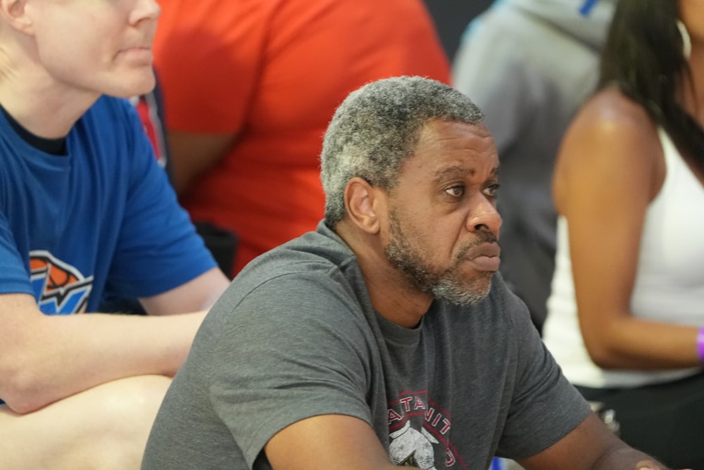 a man sitting in front of a group of people