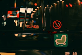 a close up of a street sign on a car