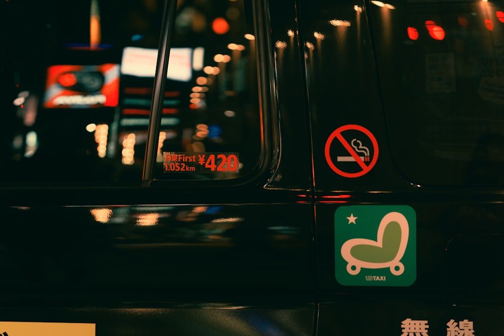 a close up of a street sign on a car