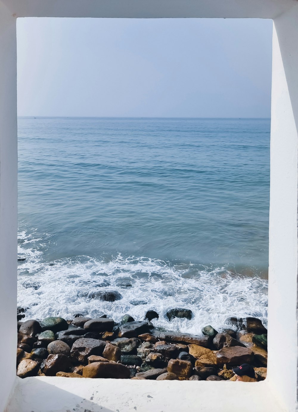 a view of the ocean through a window