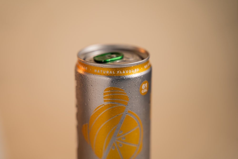 a close up of a can of beer on a table