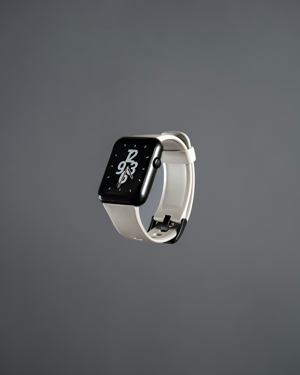 an apple watch with a black and white clock on it