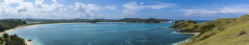 A panoramic shot of the lush island landscape surrounded by turquoise ocean.