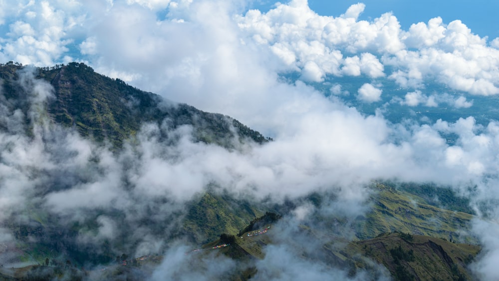 a view of a mountain covered in clouds