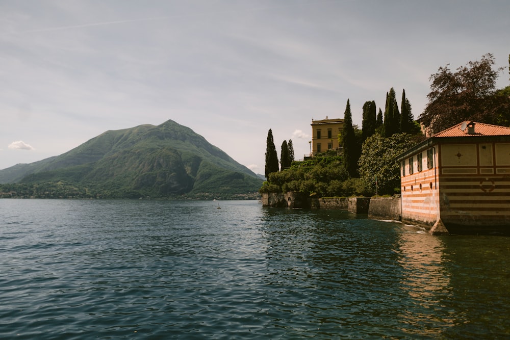 a body of water with a mountain in the background