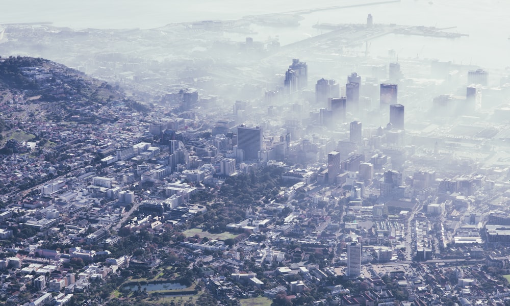 an aerial view of a city in the fog