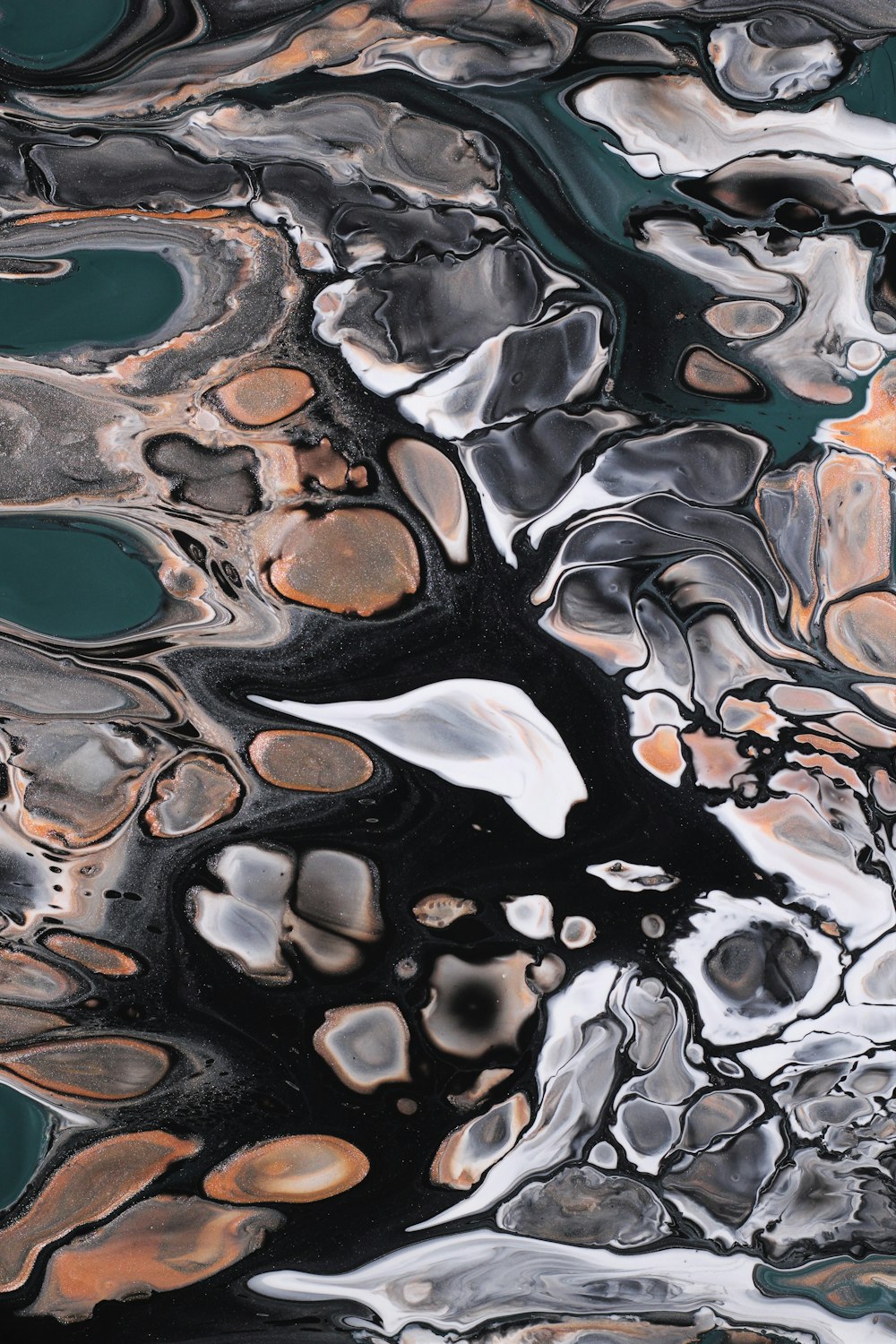 a close up of a black and white abstract painting